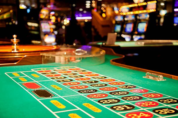 Live dealer table interface on mobile phone showing blackjack game and betting options